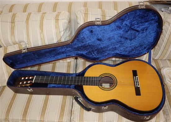 A Takumi luthier acoustic guitar with hard case